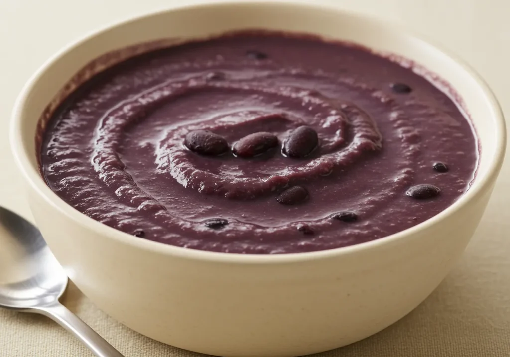 A finished bowl of purple black bean soup