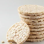 A stack of crispy, golden rice cakes on a plate, ready to be enjoyed.